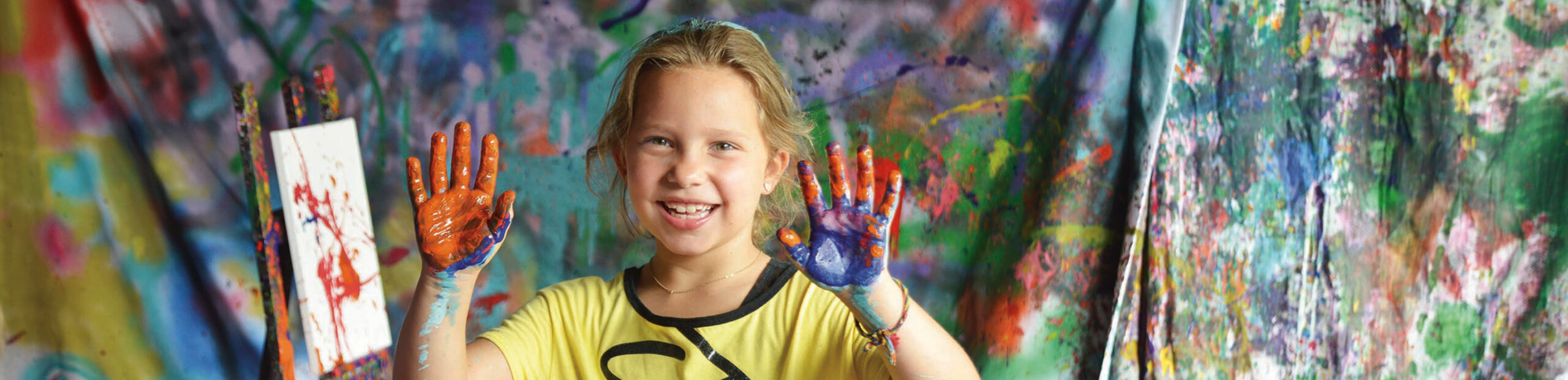 girl showing messy hands