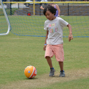 boy playing soccer